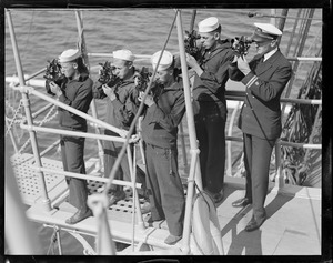 Cadets working with sextants on deck of the training ship Nantucket, while off Provincetown