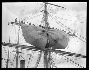 Sails of the training ship Nantucket unfurled