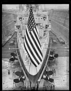 Old Glory flies from the stern of the USS Trenton in dry dock, South Boston