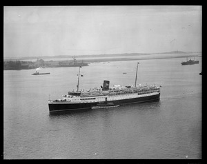 Tug guides Eastern steamship St. John into harbor