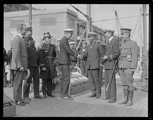 Navy men greet Japanese counterpart when Japanese battleship arrives at the new South Boston Naval Annex