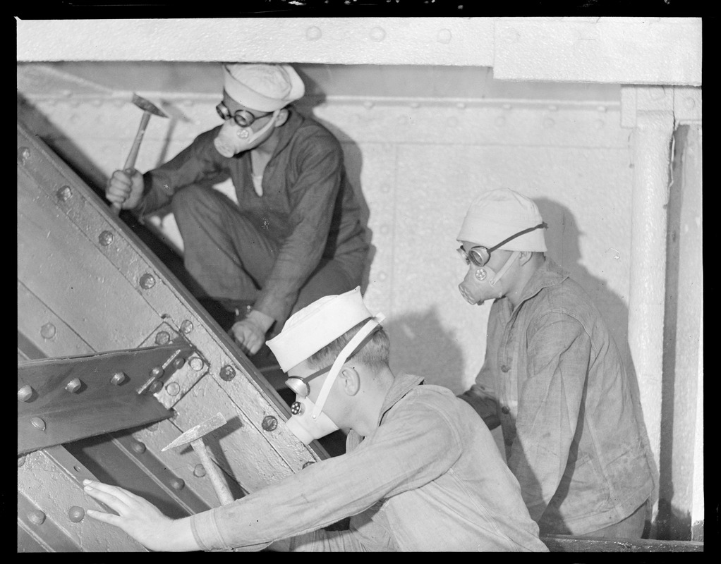 Hands working on the training ship Nantucket at Navy Yard