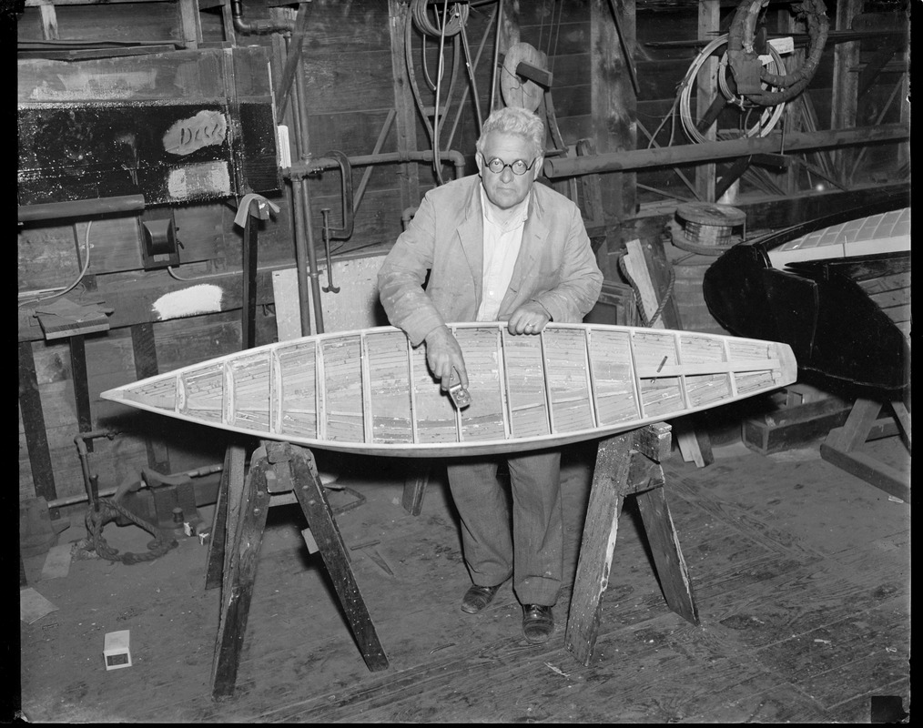 Boat builder Fred Pigeon works on miniature yacht