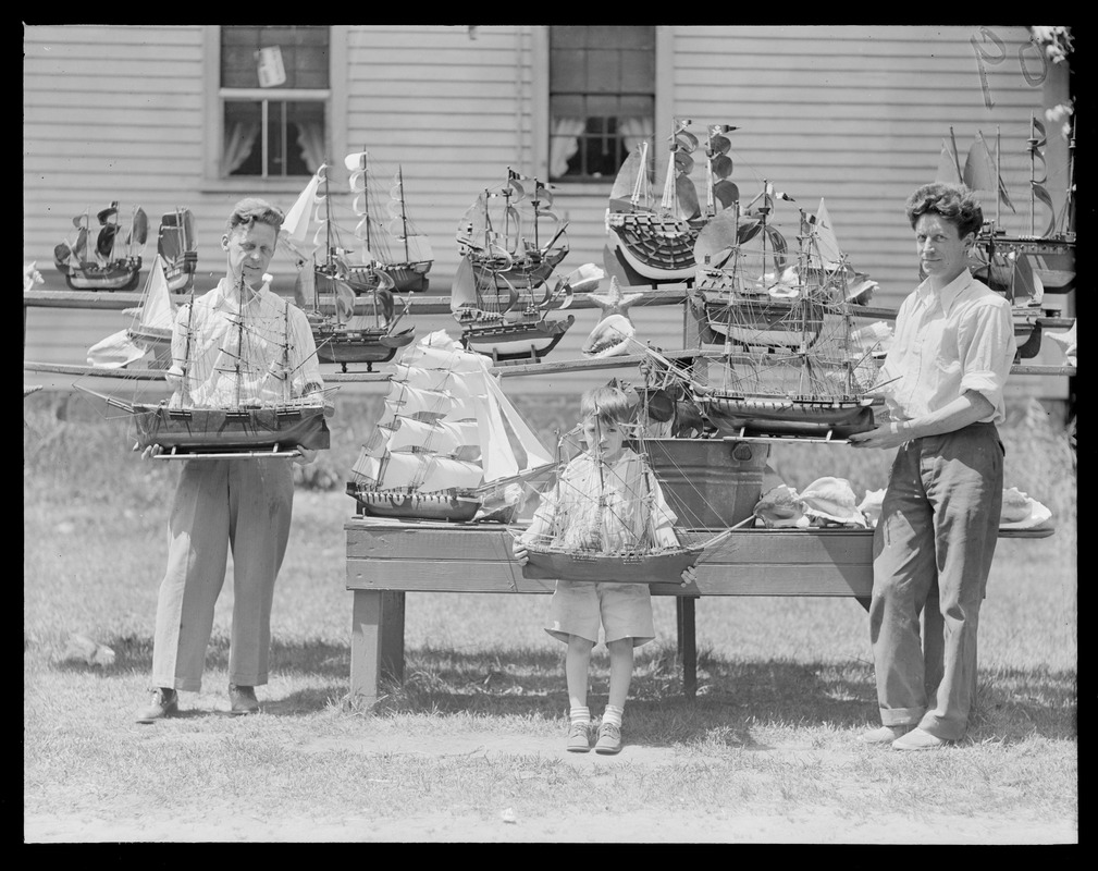 Allen brothers of North Shore build model boats of all kinds. William (I) holding Panay, Gordon Davis Jr. (5 years) holding Flying Cloud, John holding Old Ironsides. Pride's crossing.