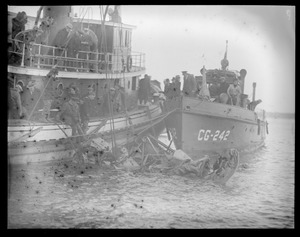 Ship wreck? Tug and Coast Guard cutter 242 alongside.