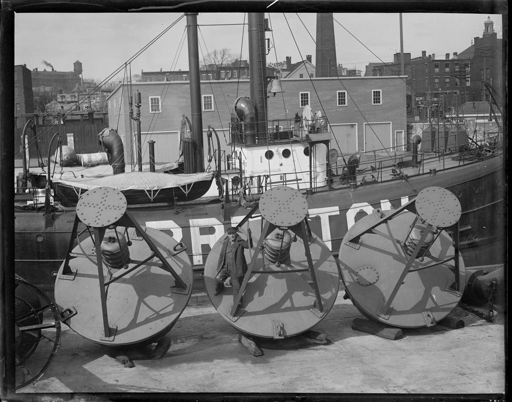 Lightship service : Chelsea. Three 1934 type 4 bell chime buoys in front of lightship Breton.