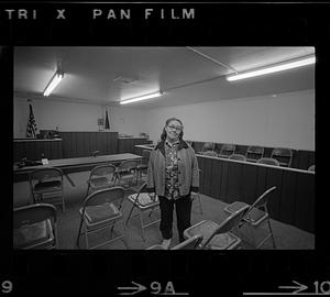 A woman stands in an empty courtroom, Alaska