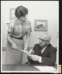 To be Honored - Prof. Norman Abbott, veteran director of placement services of Boston University, who will retire son, will be honored at dinner May 6 in George Sherman Union. Left, secretary Ann McCormick.