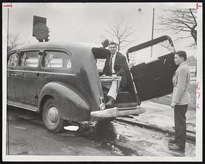 Preparing to Move Hearse before police tow it away in Cambridge are Harvard students Conrad Nibili (left) and Bill Rawls. Residents complain that hearses make neighborhoods gloomy. Buying the big, black wagons has become a fad at Harvard and MIT. Nibili and Rawls plan to drive theirs to Alaska this summer.