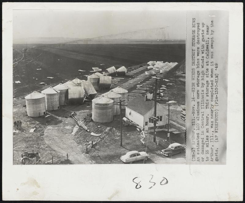 Arthur, Ill. – High Winds Destroy Storage Bins – An estimated 100 aluminum corn storage bins were destroyed or damaged in Central Illinois by high winds with gusts up to 55 miles an hour. This storage site at Caldwell, near Arthur, Ill., was nearly completed when it was swept by the gusts.