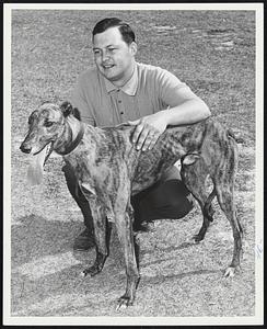 Raynham-Bound are Tim Andrews, trainer for the Ted Lippold kennel, and one of his charges, Count Marquay. Lippold's kennel, in action at Florida this winter, will race for the 31st year at Raynham.