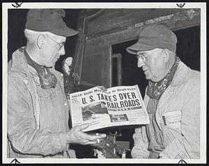 Will Work for Uncle Sam- Gordon Murray of Cambridge, left, fireman of the Shore Line Express of the New Haven Railroad, and Ira A. Ballou of Providence, engineer, learned of the government's decision to take over the railroads to avert a strike, when they finished their run at the South Station last night.