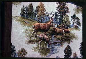 Needlepoint picture of deer by a stream