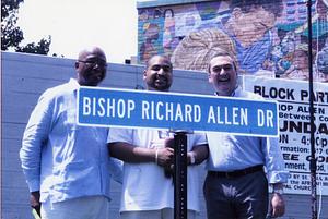 Photo with Bishop Richard Allen Drive street sign, 2010