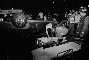 A Revere Ambulance EMT and Capt Archie Resca tending to an accident victim