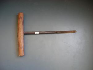 T-shaped wooden and metal tool