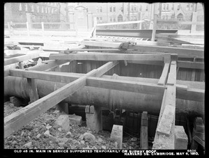 Distribution Department, Low Service Pipe Lines, old 48-inch main in service, supported temporarily on subway roof, Harvard Square, Cambridge, Mass., May 6, 1910