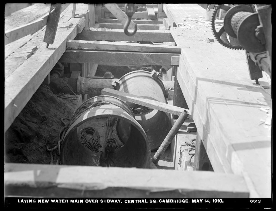 Distribution Department, Low Service Pipe Lines, laying new water main over subway, Central Square, Cambridge, Mass., May 14, 1910