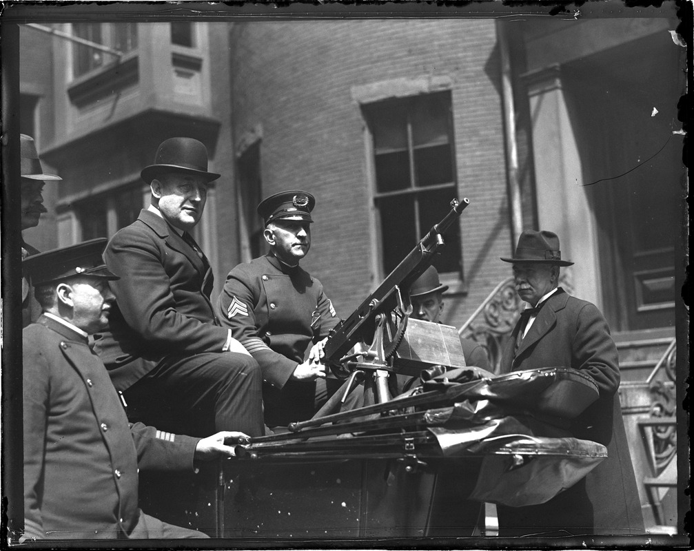 Superintendent Michael Crowley with machine gunners at headquarters. They are ready for big May Day riots.