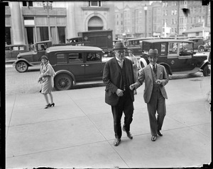 Police commissioner Eugene Hultman entering police headquarters after Herbert Wilson was kicked out of office