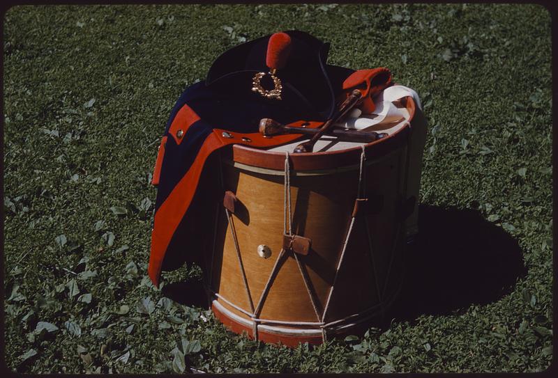 Drum and marching band uniform coat on grass