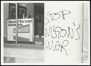 State St Bank Boylston + Mass Ave. "Sign Discover your Town" on left and on right - Destruction on banks support by Rioters