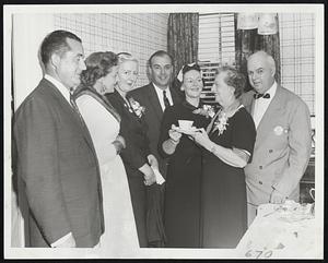 Republican Candidates for governor and state treasurer, their wives, and the wife of the GOP candidate for lieutenant governor, have tea at home of Mr. and Mrs. Charles Adams of Dorchester. Left to right, Robert Beaudreau of Mariboro, candidate for treasurer, and Mrs. Beaudreau; Mrs. Charles Gibbons, wife of candidate for lieutenant governor; Lt. Gov. Sumner G. Whittier, candidate for governor; Mrs. Whittier, and Mr, and Mrs. Adams.