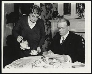 Attorney Frederick W. Mansfield at the Breakfast Table like a champion fighter, Mr Mansfield relies solely upon one trusted person to prepare his meals. In this case it is Mrs Mansfield, shown here serving breakfast at home.