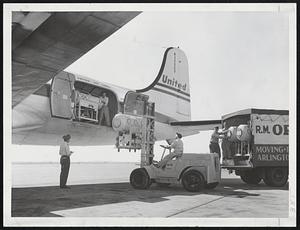 Four Iron Lungs, shipped to Boston from Chicago, are unloaded today at Boston Airport. These will go to Boston Children's Hospital. This makes a total of 42 iron lungs shipped from 11 cities throughout the United States by the "March of Dimes" in the fight against polio in Massachusetts.