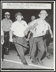 Hartford, Conn. – Off The Grounds – Waterbury police carry individual involved in racial disturbance in city’s north end, last night.