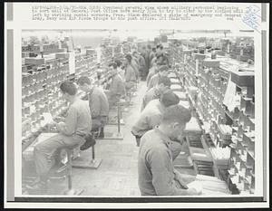 Overhead general view shows military personnel beginning to sort mail at General Post Office here early 3/24 to try to clear up the clogged mail left by striking postal workers. Pres. Nixon declared a state of emergency and ordered Army, Navy and Air Force troops to the post office.