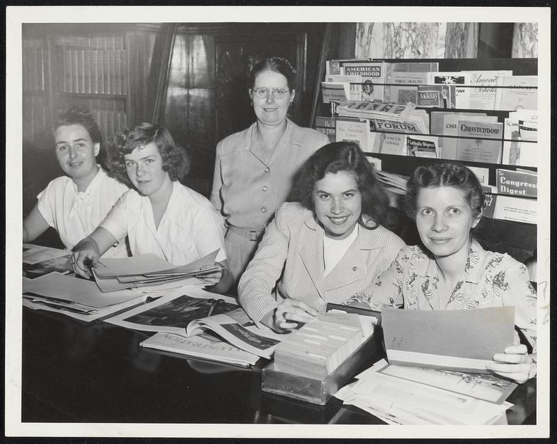 Adding to the Large and Much-Used picture file at the Attleboro public library are (left to right) Janet Bandilli, Jean Faulkner, Lucille Paquette and (standing) head librarian Lucille Cavender.