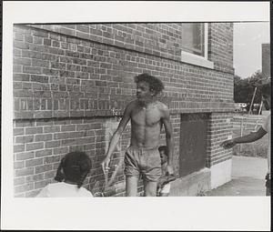 Young man shaking off some water