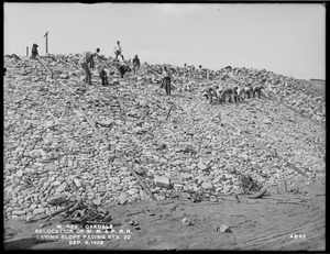 Wachusett Reservoir, relocation of Worcester, Nashua & Portland Division of Boston & Maine Railroad, laying slope paving, station 22, Oakdale, West Boylston, Mass., Sep. 8, 1902
