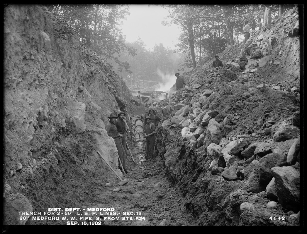 Distribution Department, Low Service Pipe Lines, Section 12, trench for two 60-inch pipe lines, 20-inch Medford Water Works pipe, southerly from station 524, Medford, Mass., Sep. 16, 1902