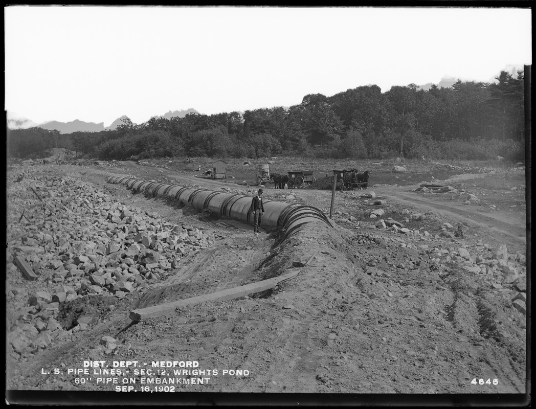 Distribution Department, Low Service Pipe Lines, Section 12, Wright's Pond, 60-inch pipe on embankment, Medford, Mass., Sep. 16, 1902