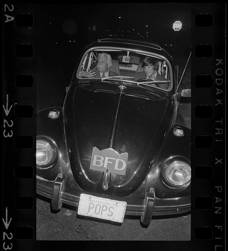 Arthur Fiedler and son go looking for fires. Note special "BFD" plate and "POPS" license plate, Boston