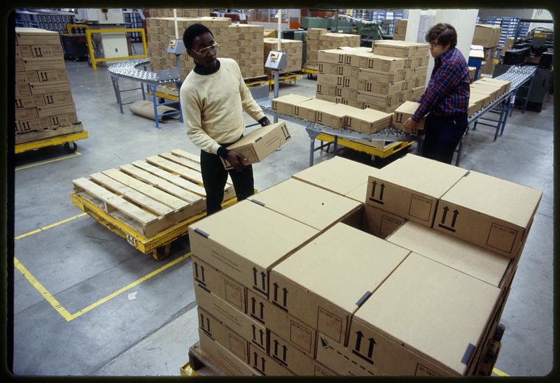 Loading boxes at Polaroid Corporation warehouse, Cambridge