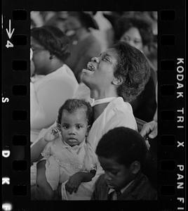 Emotional African-American mom at Easter church service in Roxbury, Boston