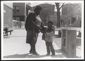 Woman and young boy in Washington Elms in courtyard