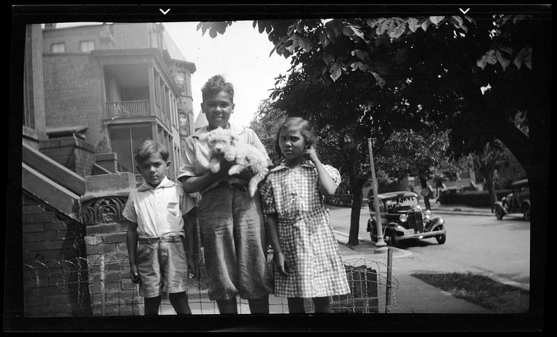 Two boys, a girl and a dog