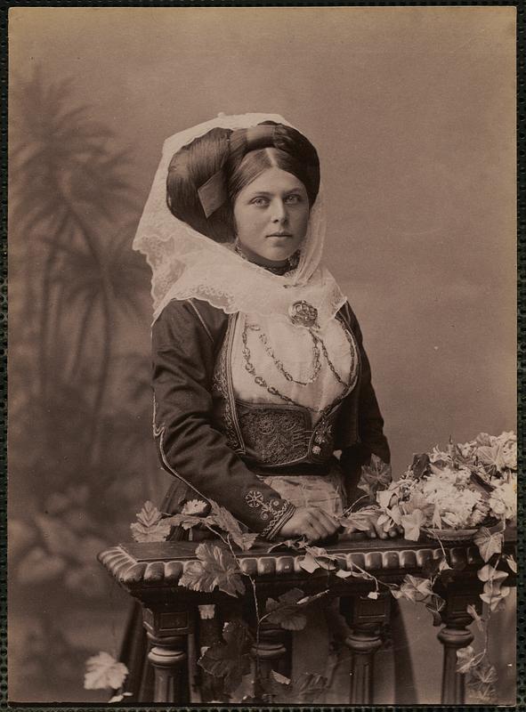 Studio portrait of woman in traditional Greek dress