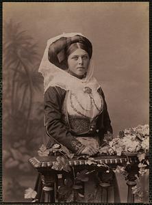 Studio portrait of woman in traditional Greek dress