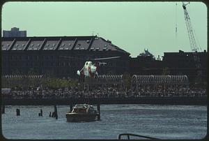 Small helicopter above the water at Christopher Columbus Park, Boston