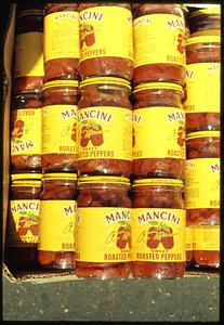 Stacked jars of Mancini sweet roasted peppers