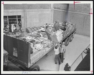 Food and Clothing are loaded on truck at Salvation Army quarters on Berkeley St. The goods, all donated, are destined for the flood-stricken areas of western Massachusetts.