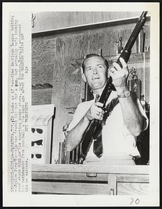 It looks as if two-time American League batting champion Pete Runnels has traded his bat for a gun, but actually he’s looking over stock 5/28 in his sporting goods store, near Houston.Runnels announced his retirement from baseball a few days ago after the Houston Colts put him on waivers.