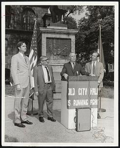 Mayor White signs deed for private renovation of 105-year old City Hall at ceremonies beneath Ben Franklin statute. From left: Corp. Counsel Herbert P. Gleason; City Counsil President Gabriel F. Piemonte; the mayor; Roger S. Webb, president, Old City Hall Landmark Corp.