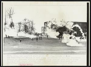 Kent State Students Riot.. Clouds of tear gas hang over the campus of Kent State University as National Guardsman attempt to disperse rioting students. Four persons were killed today in the fourth day of rioting over President Nixon's Southeast Asian policies.