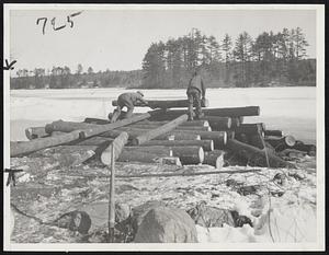 Government Salvage of Hurricane Timber in New England. Adams Pond Derry N.H.; Farmers delivering the first batch of logs in Adams pond at Derry N.H. this pond will store about 4 million feet of lumber and is the first to be opened for storage in the government project. Each farmer has to build his own skids and pile his logs on the shore for the scaler to check and when they are checked the farmer must put them into the pond himself.